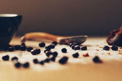 Close-up of coffee beans on table