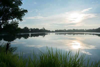 Scenic view of lake against sky during sunset