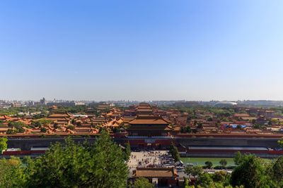 High angle view of trees and buildings against sky