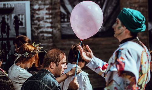 Group of people holding balloons