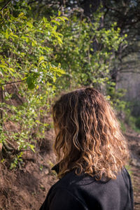 Woman standing in forest