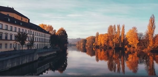 Reflection of trees in lake against sky during autumn