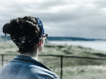 Rear view of woman looking at sea