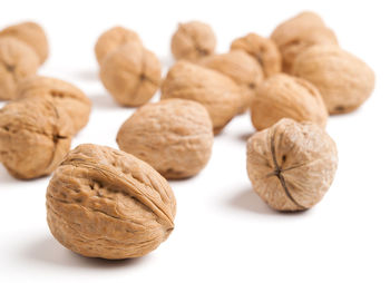 Close-up of breads against white background