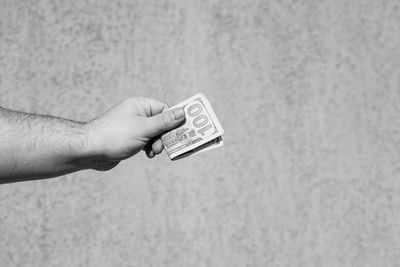 Close-up of hand holding paper currency