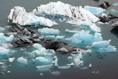 View of ice in lake against sky