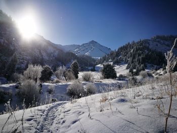 Scenic view of snowcapped mountains against clear sky