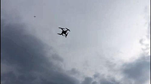 Low angle view of silhouette helicopter against sky