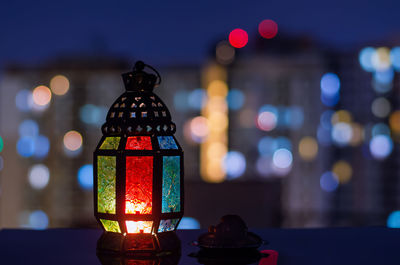 Lantern and small plate of dates fruit for holy month of ramadan kareem.