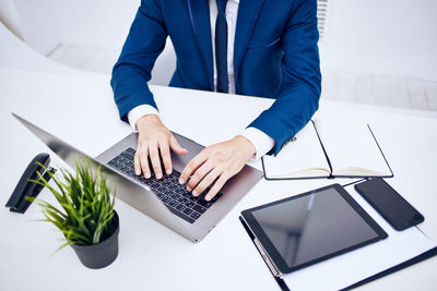 Low angle view of woman working on table