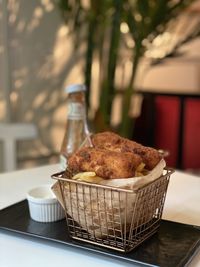 Close-up of drink in basket on table