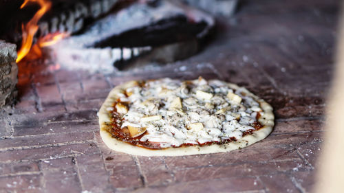 Close-up of pizza on cutting board