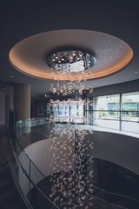 Reflection of illuminated glass window in restaurant