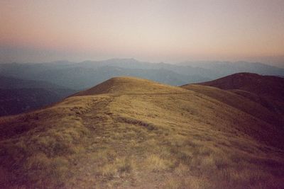 Scenic view of mountains against sky during sunset