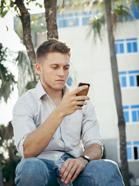 Young man using mobile phone