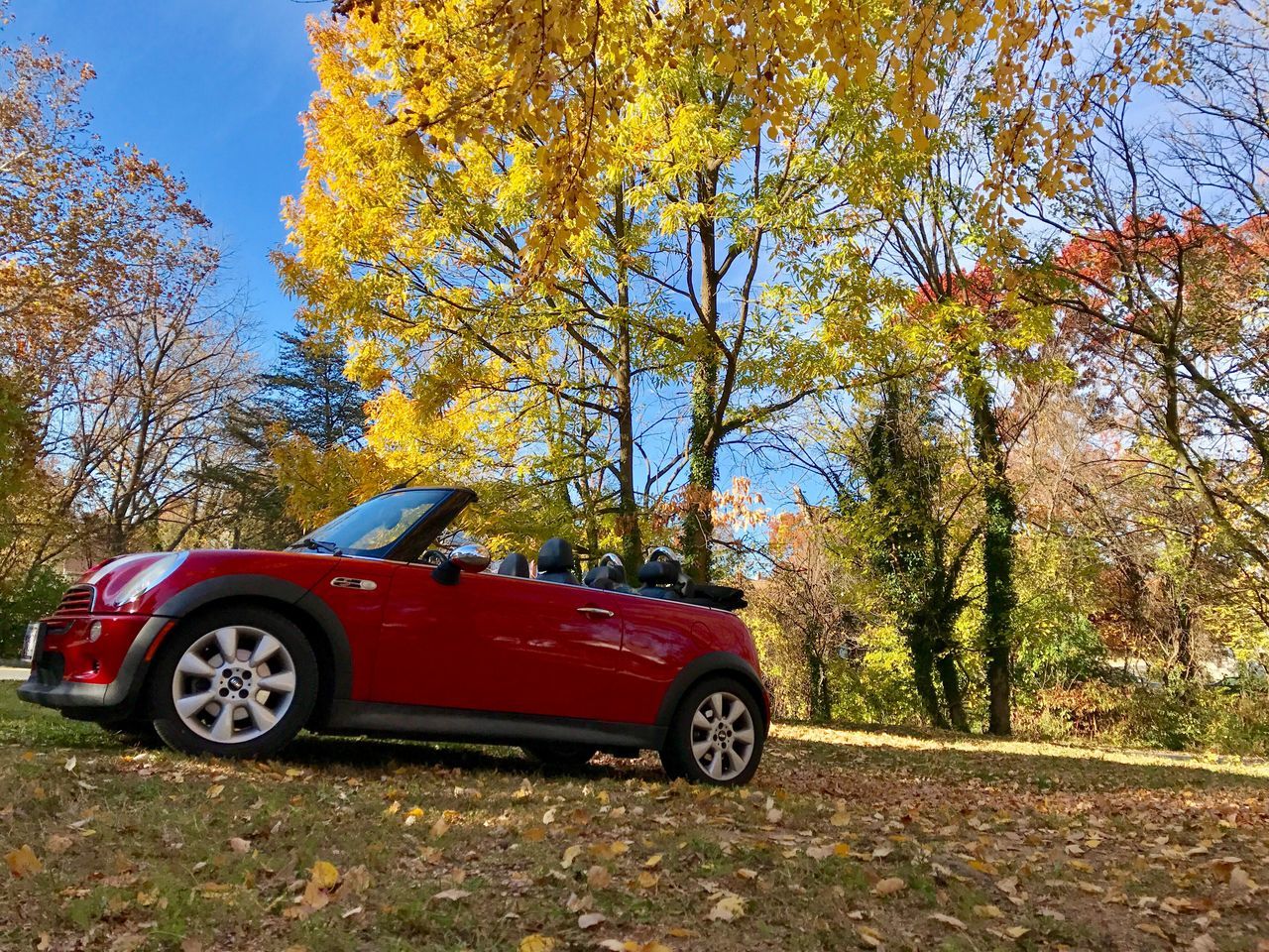 RED CAR AGAINST SKY