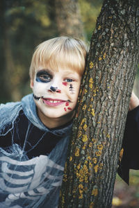 Portrait of halloween boy in skeleton costume 
