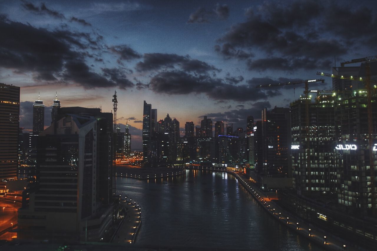 architecture, sky, city, cloud - sky, skyscraper, building exterior, illuminated, built structure, urban skyline, cityscape, no people, river, modern, outdoors, sunset, water, night