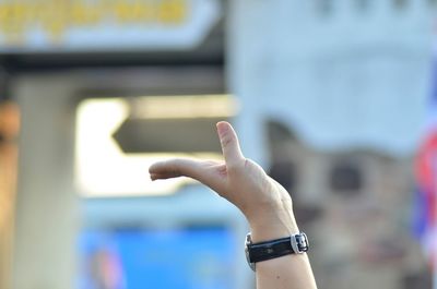 Cropped hand of person gesturing outdoors