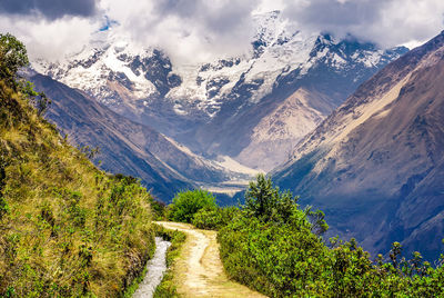 Scenic view of snowcapped mountains against sky