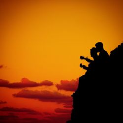 Silhouette of men at sunset