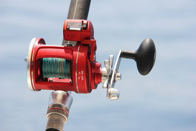 A close-up of the trolling coil against the sea. fishing and fishing supplies.