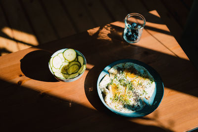 High angle view of breakfast served on wooden table