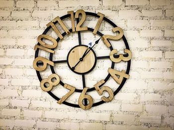 Close-up of clock on wall