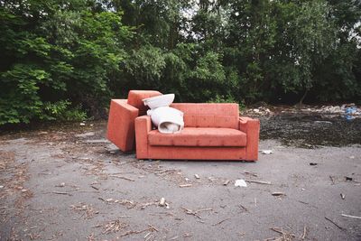 View of damaged sofa with chair