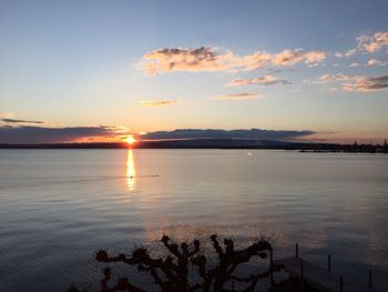 Scenic view of lake at sunset