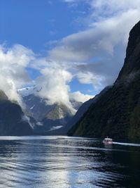 Scenic view of lake and mountains against sky