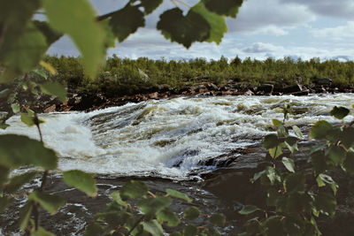 Scenic view of river against sky