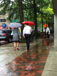 Full length of woman walking on footpath