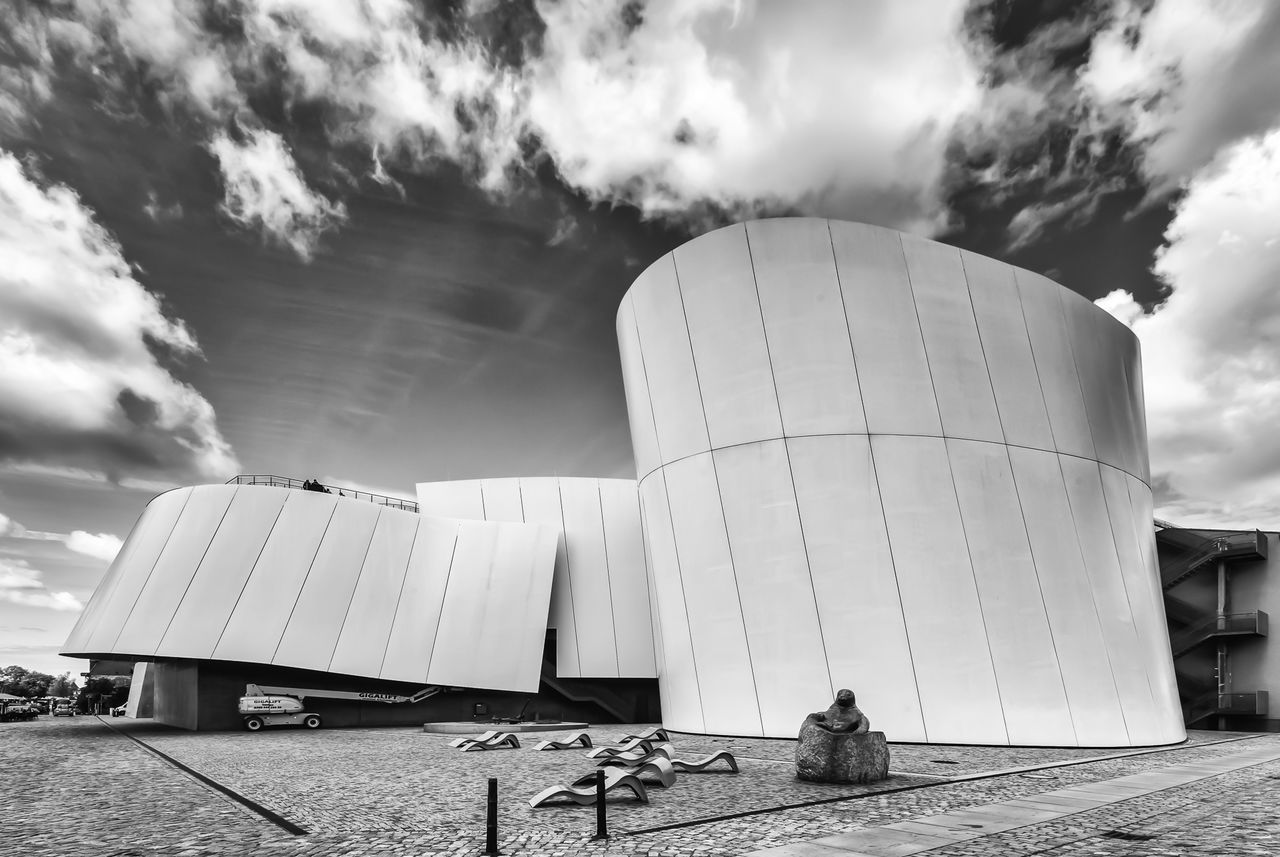 sky, cloud - sky, built structure, architecture, building exterior, cloudy, cloud, low angle view, day, outdoors, sunlight, travel destinations, incidental people, modern, no people, tree, travel, famous place, city, weather