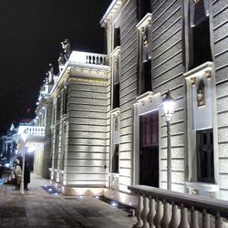 Buildings in city at night