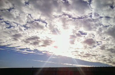 Sun shining through clouds