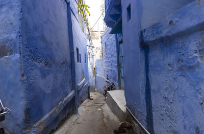 Empty alley amidst buildings