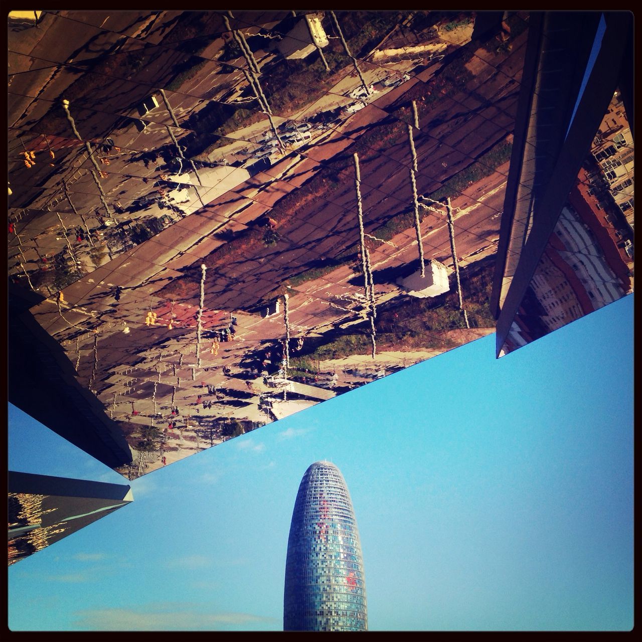 architecture, built structure, transfer print, building exterior, auto post production filter, low angle view, city, modern, sunlight, clear sky, day, sky, outdoors, travel destinations, no people, blue, bridge - man made structure, connection, tower, office building