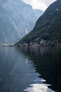 Scenic view of sea and mountains against sky