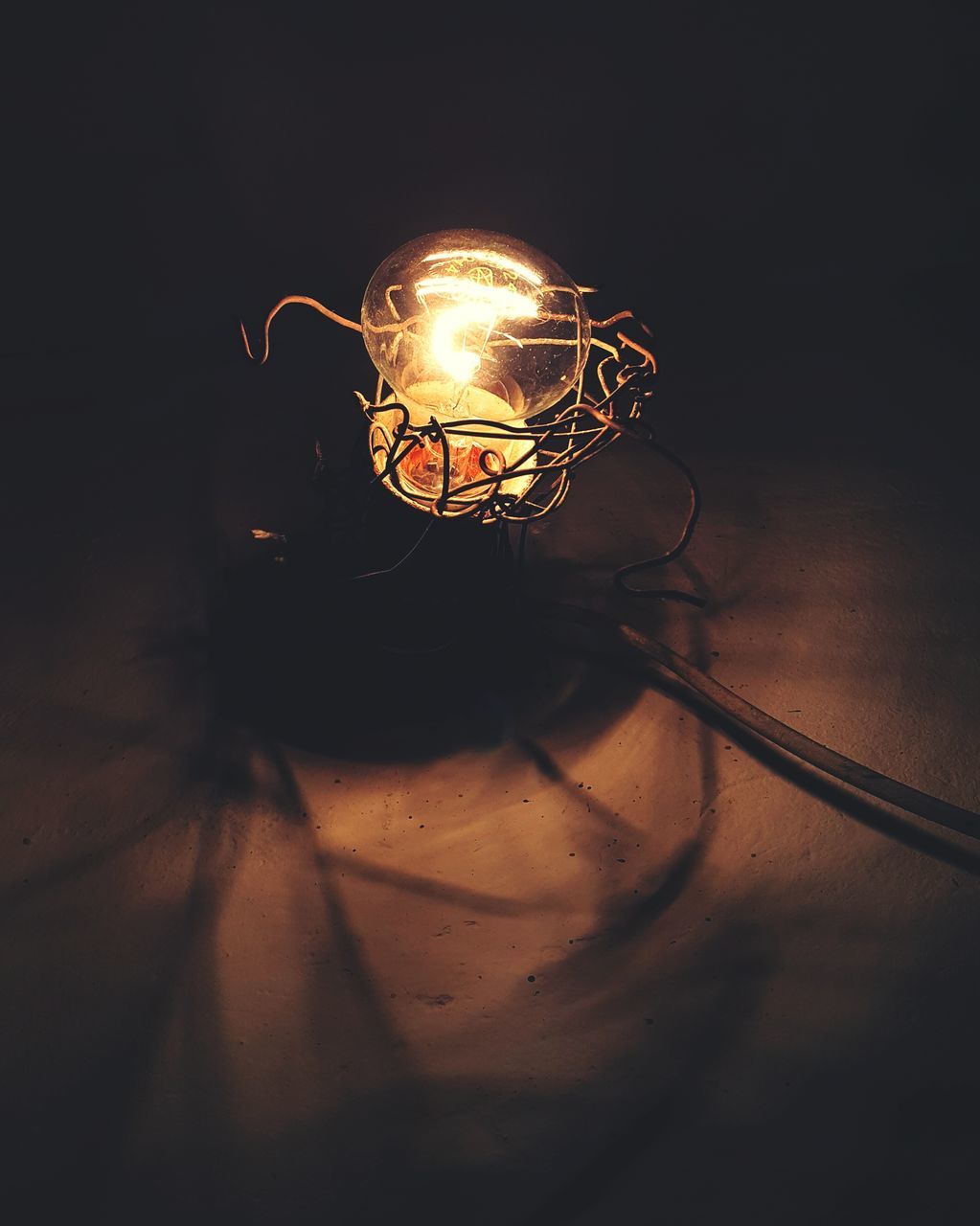 illuminated, indoors, lighting equipment, night, close-up, dark, glowing, electricity, light - natural phenomenon, darkroom, light bulb, lit, focus on foreground, electric light, light, home interior, hanging