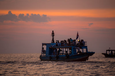 Ferry boat in calm sea against the sky