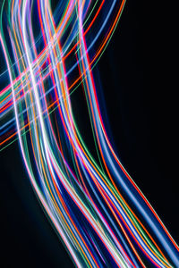 Close-up of light painting against black background