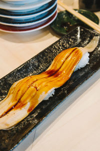 High angle view of fish in plate on table