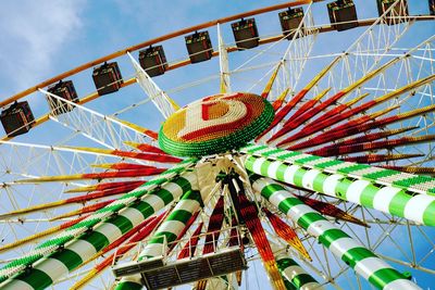 Low angle view of ferris wheel against sky