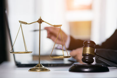 Close-up of clock on table