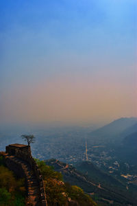 High angle view of buildings in city during sunset