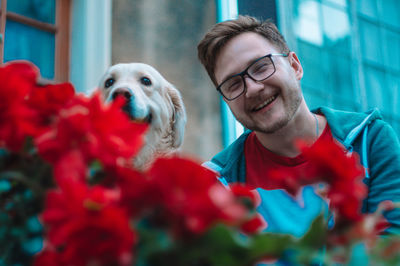 Portrait of smiling young woman with dog