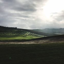 Scenic view of agricultural field against sky