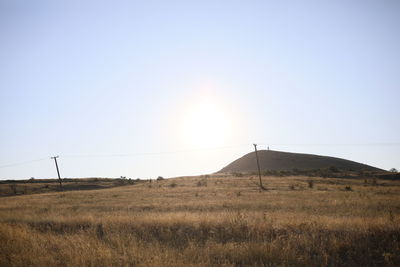 Scenic view of field against clear sky