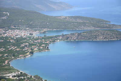 Aerial view of sea and buildings in town